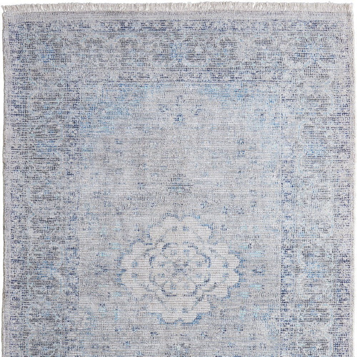 5' X 8' Gray Blue and Ivory Oriental Hand Woven Distressed Area Rug With Fringe