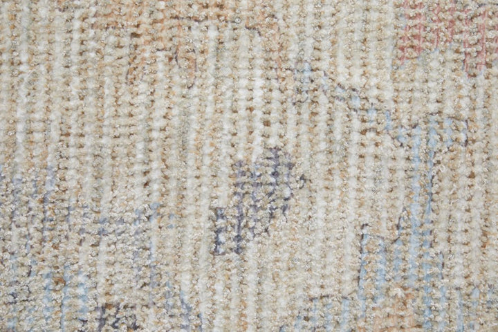 4' X 6' Ivory Tan and Blue Floral Hand Woven Distressed Area Rug With Fringe