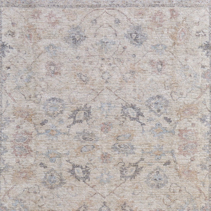 4' X 6' Ivory Tan and Blue Floral Hand Woven Distressed Area Rug With Fringe