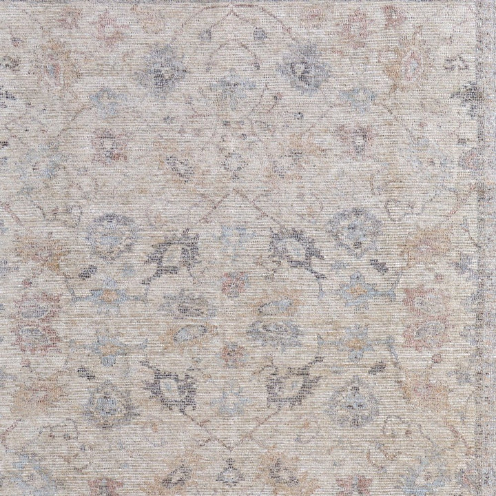4' X 6' Ivory Tan and Blue Floral Hand Woven Distressed Area Rug With Fringe