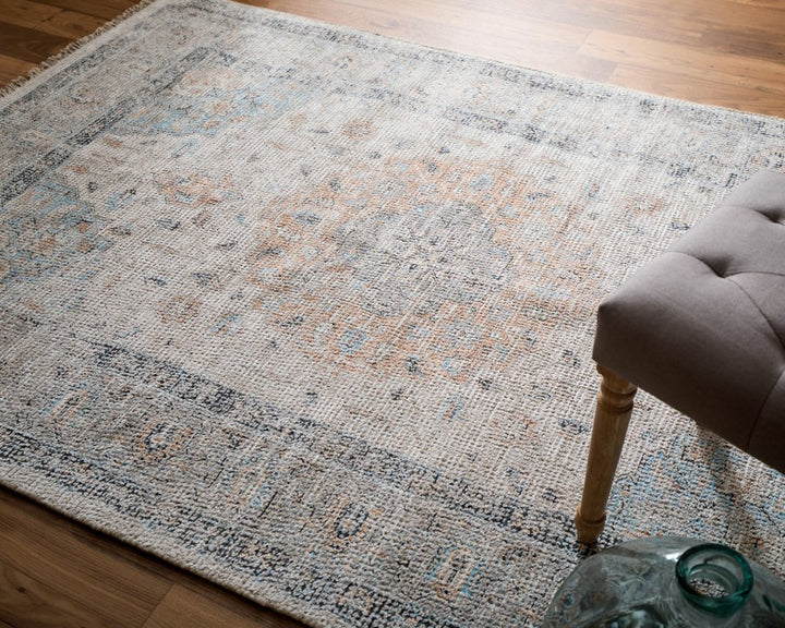4' X 6' Ivory Blue and Orange Oriental Hand Woven Distressed Area Rug With Fringe
