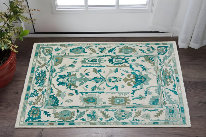 2' X 3' Green and Ivory Wool Floral Hand Knotted Area Rug With Fringe