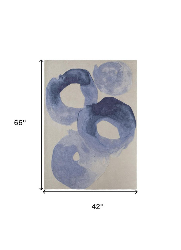 4' X 6' Blue and Ivory Abstract Hand Tufted Area Rug