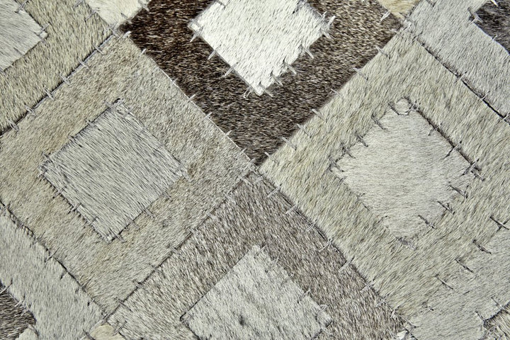 6' X 9' Black Gray And White Faux Cowhide Geometric Area Rug