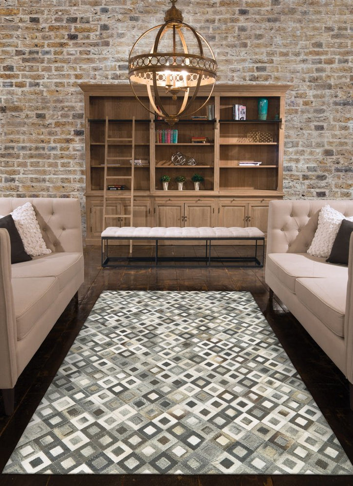 6' X 9' Black Gray And White Faux Cowhide Geometric Area Rug