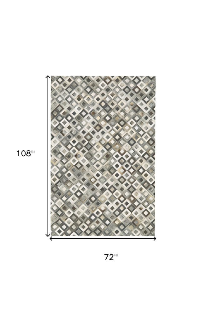6' X 9' Black Gray And White Faux Cowhide Geometric Area Rug