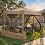 Brown octagonal pop-up screen gazebo set up on a backyard lawn with a dining table and chairs inside