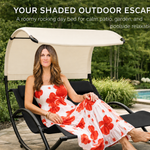 Woman relaxing on a navy chaise lounger with canopy shade beside a pool