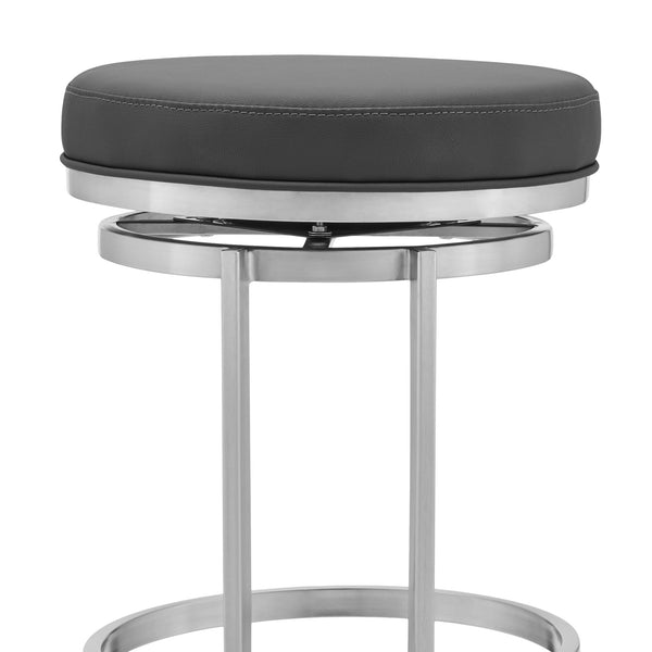 26" Gray And Silver Faux Leather And Iron Swivel Backless Counter Height Bar Chair