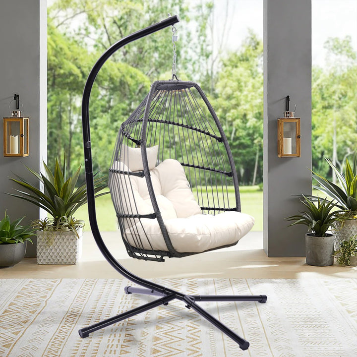 Outdoor Patio Wicker Folding Swing Hammock Egg Chair With Cushion And Pillow, Beige - 330lb Capacity Single Hanging Chair with Steel Stand for Indoor/Outdoor Relaxation