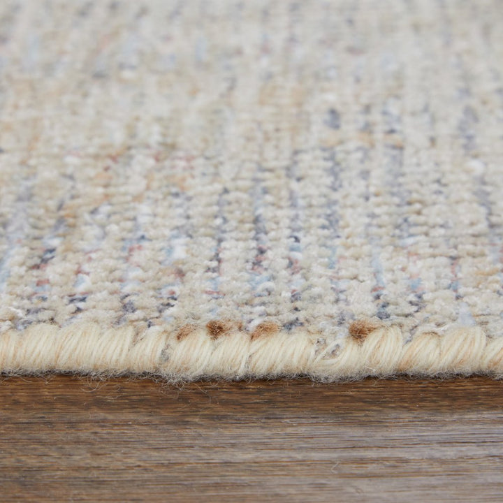 4' X 6' Ivory Tan and Blue Floral Hand Woven Distressed Area Rug With Fringe