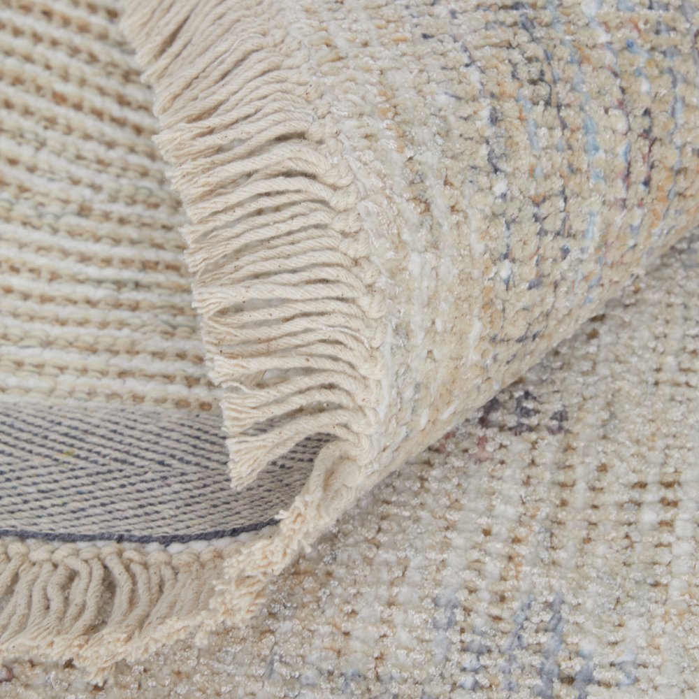 4' X 6' Ivory Tan and Blue Floral Hand Woven Distressed Area Rug With Fringe