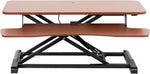 Black standing desk converter shown raised to standing height with keyboard tray extended - Dark Walnut 36"