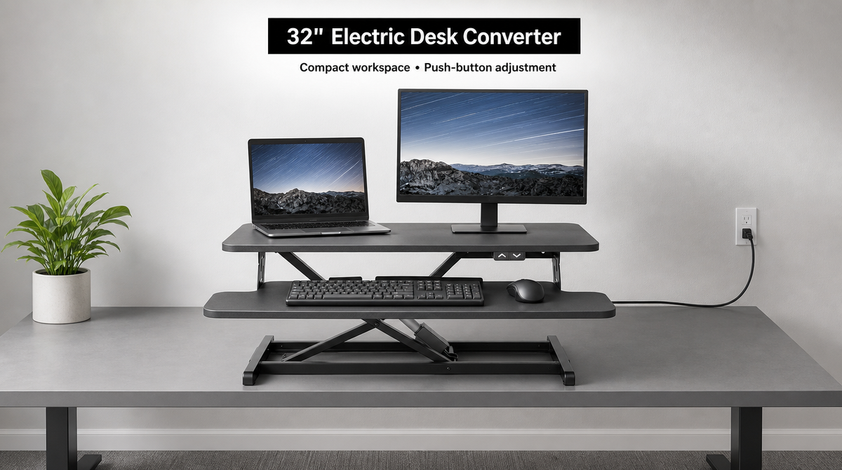 “32-inch electric desk converter with a laptop and monitor, up/down buttons, and a cord connected to a wall outlet.”