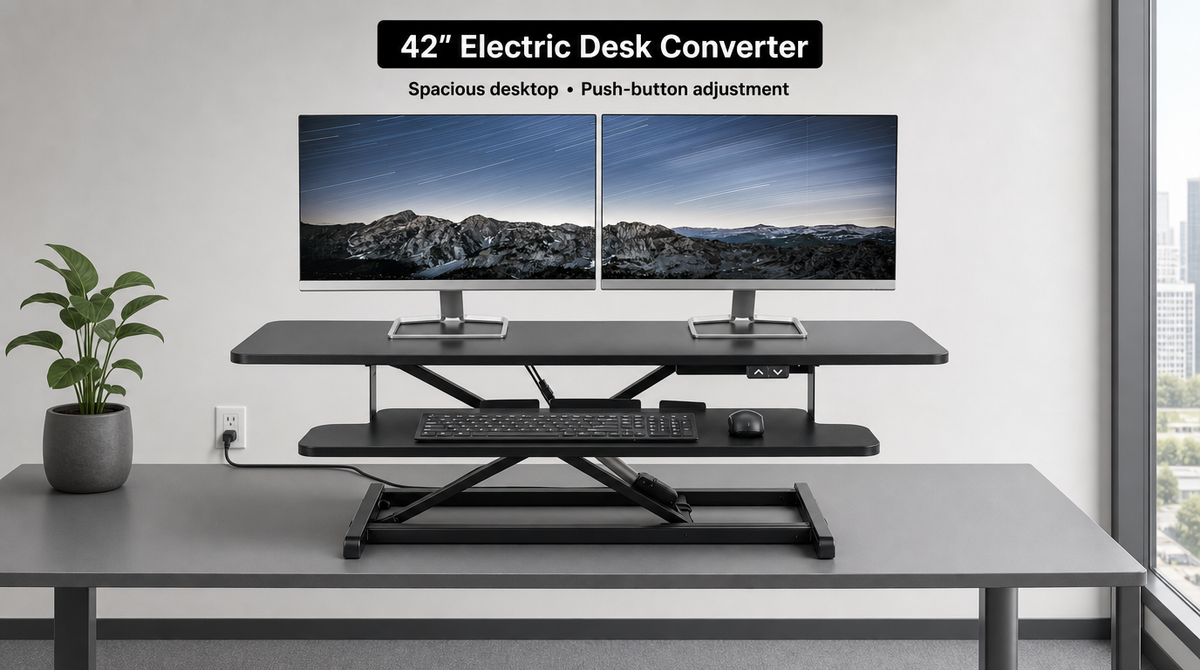 “42-inch electric desk converter with dual monitors on a wide upper platform and a narrower keyboard tray below.”