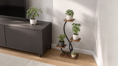 “Compact four-tier plant stand with brown shelves and a black S-shaped frame tucked beside a TV cabinet.”