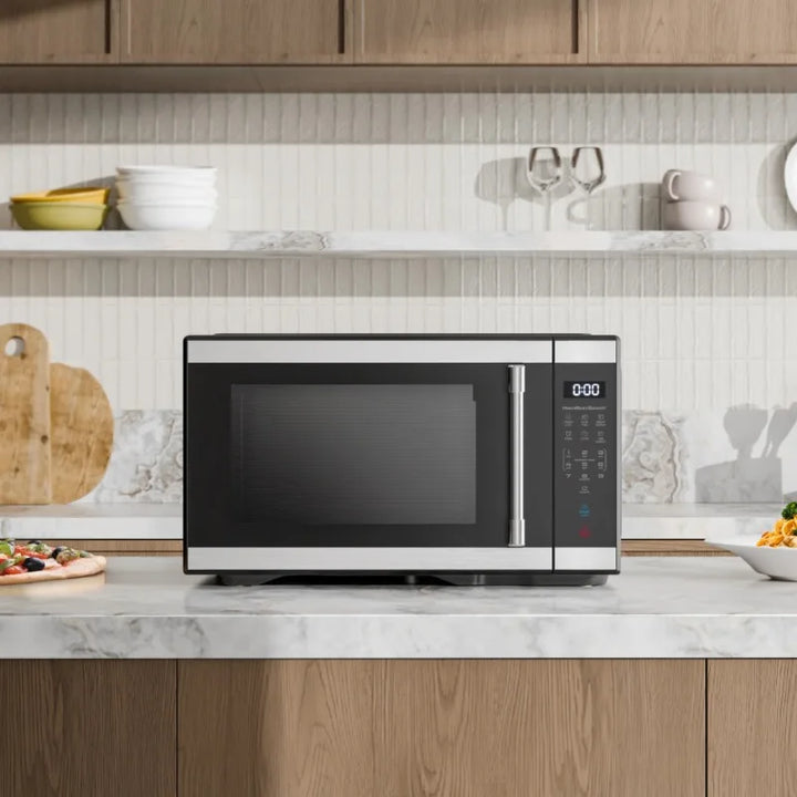 Hamilton Beach 1.1 Cu ft Countertop Microwave Oven, White and Stainless Steel