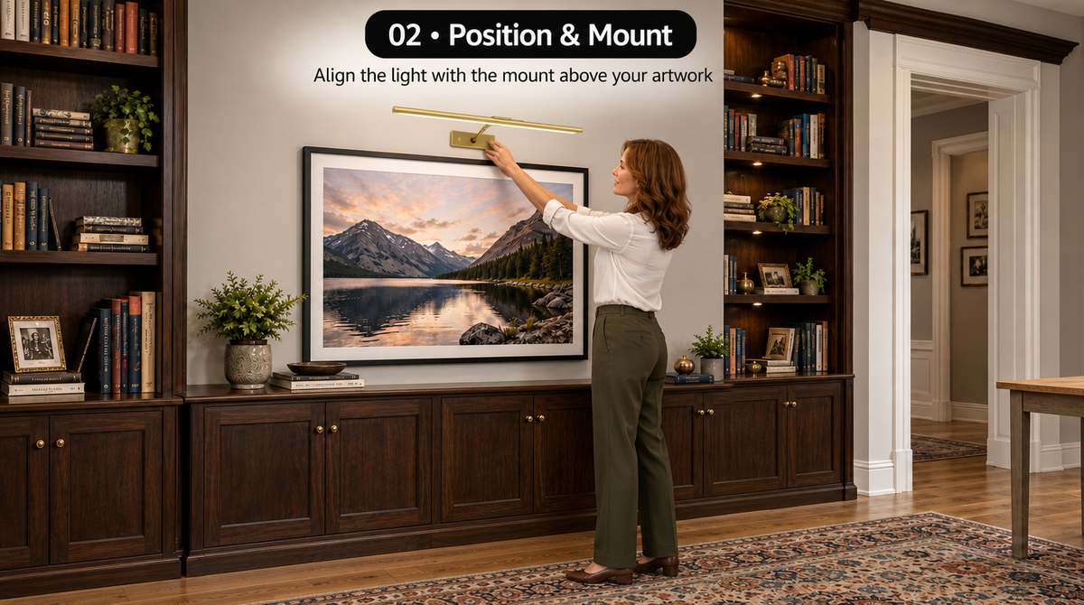 “Step 2: Align the gold picture light with its wall mount above the framed artwork.”