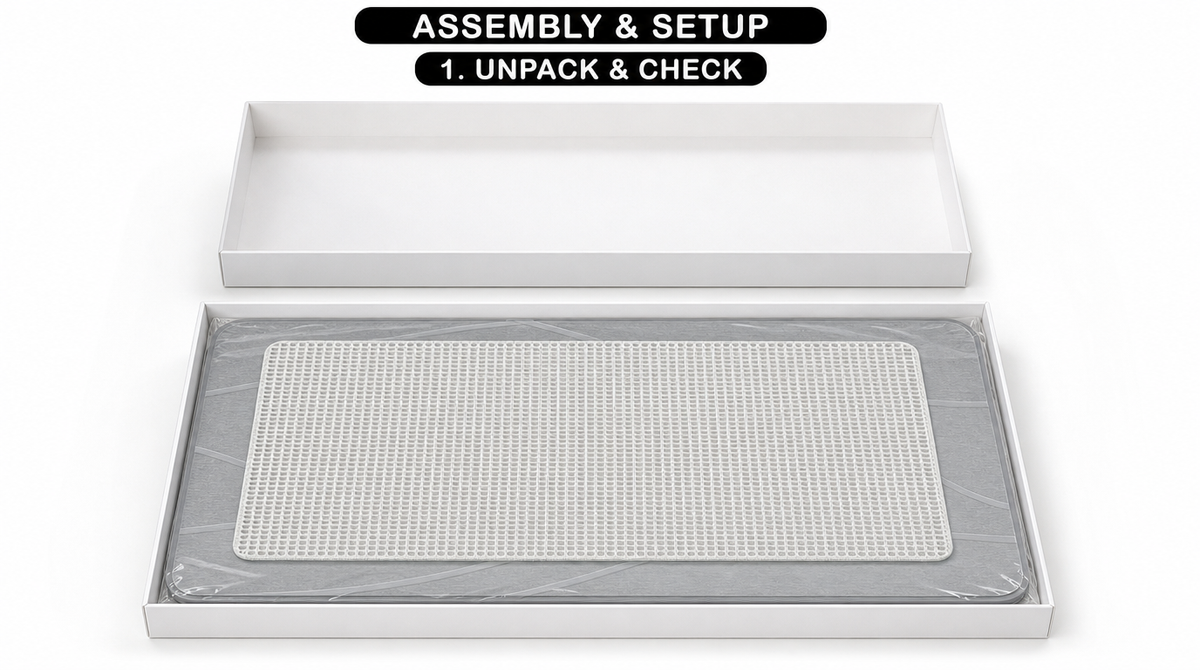 Step 1: Unpack and check the stone bath mat, shown in an open box with the mesh under-pad resting on top.