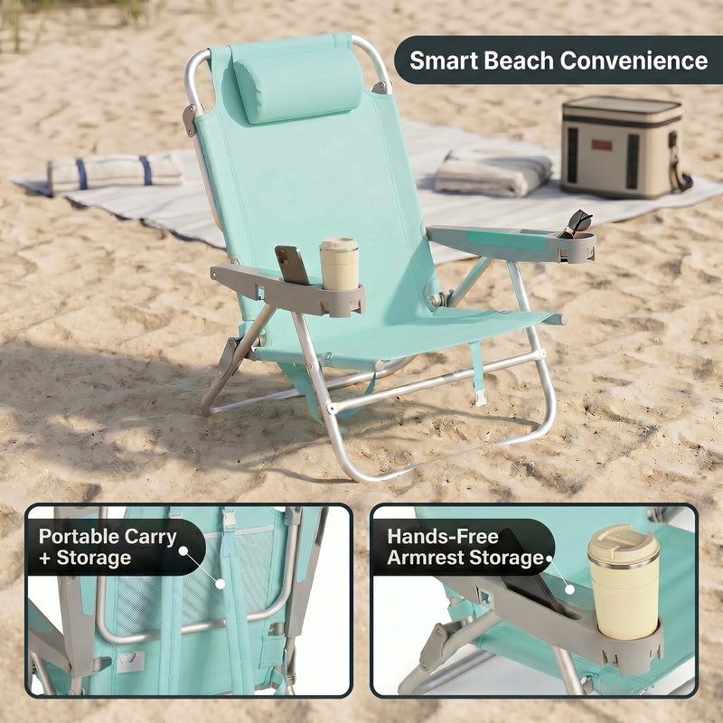 Two reclining backpack beach chairs on the beach highlighting the 5-position recline, the side storage pocket holding keys and a phone, and the padded neck pillow