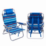 Front and back view of the backpack beach chair in light blue stripe, showing the reclined seat, padded headrest, gray armrests, and buckled backpack straps