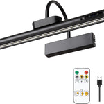 Battery operated picture light on a wall bracket beside the remote control