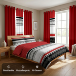 Striped bedding set with matching curtains in a sunlit bedroom, with breathable, hypoallergenic and all-season icons