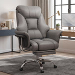 Cream-white big and tall PU leather office chair with footrest in a home office