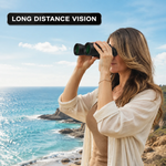 Woman using high-powered binoculars to view a mountain landscape at sunset