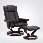 Black faux leather swivel recliner with matching ottoman on a wood swivel base