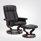 Black faux leather swivel recliner with matching ottoman on a wood swivel base
