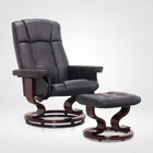 Black faux leather swivel recliner with matching ottoman on a wood swivel base