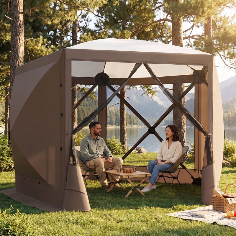 Brown pop-up screen gazebo at a forest lakeside campsite with two people seated at a table inside
