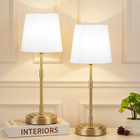 Black cordless rechargeable table lamp with linen fabric shade, lit