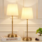 Black cordless rechargeable table lamp with linen fabric shade, lit