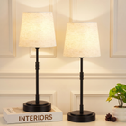 Black cordless rechargeable table lamp with linen fabric shade, lit