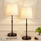 Black cordless rechargeable table lamp with linen fabric shade, lit
