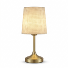 Black cordless rechargeable table lamp with linen fabric shade, lit