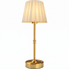 Black cordless rechargeable table lamp with linen fabric shade, lit