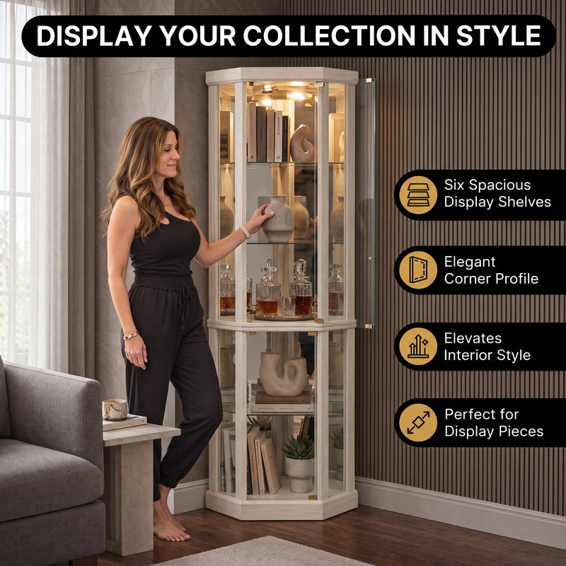 Person arranging décor inside the open glass door of the tall oak corner curio cabinet