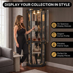 Person arranging décor inside the open glass door of the tall oak corner curio cabinet