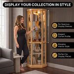 Person arranging décor inside the open glass door of the tall oak corner curio cabinet