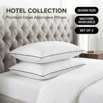 Down alternative pillows stacked on a bed against a gray tufted headboard under a Hotel Collection banner