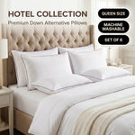 Down alternative pillows stacked on a bed against a gray tufted headboard under a Hotel Collection banner