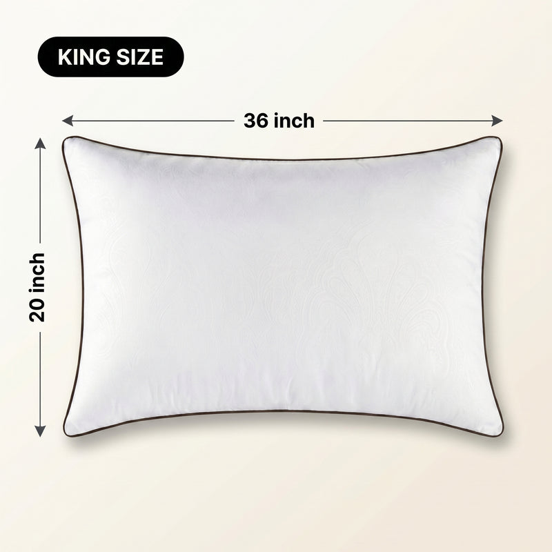 Woman holding a down alternative pillow beside a Queen size dimension graphic showing 30 inch by 20 inch measurements