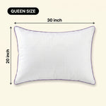 Woman holding a down alternative pillow beside a Queen size dimension graphic showing 30 inch by 20 inch measurements