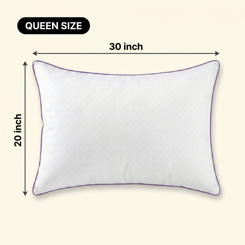 Woman holding a down alternative pillow beside a Queen size dimension graphic showing 30 inch by 20 inch measurements