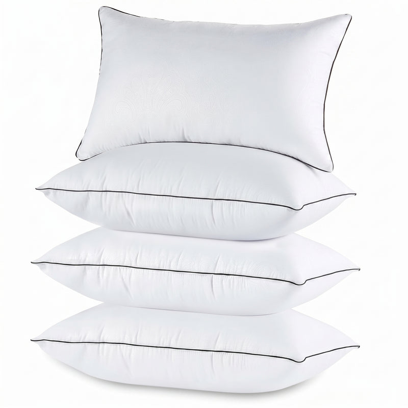 Two down alternative pillows with brown piping and a subtle damask pattern, stacked on a white background