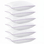 Two down alternative pillows with brown piping and a subtle damask pattern, stacked on a white background
