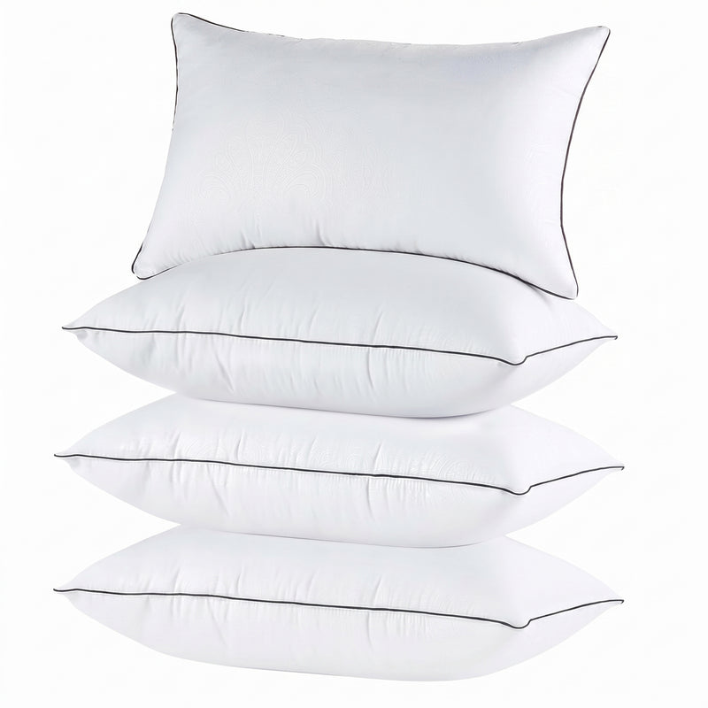 Two down alternative pillows with brown piping and a subtle damask pattern, stacked on a white background